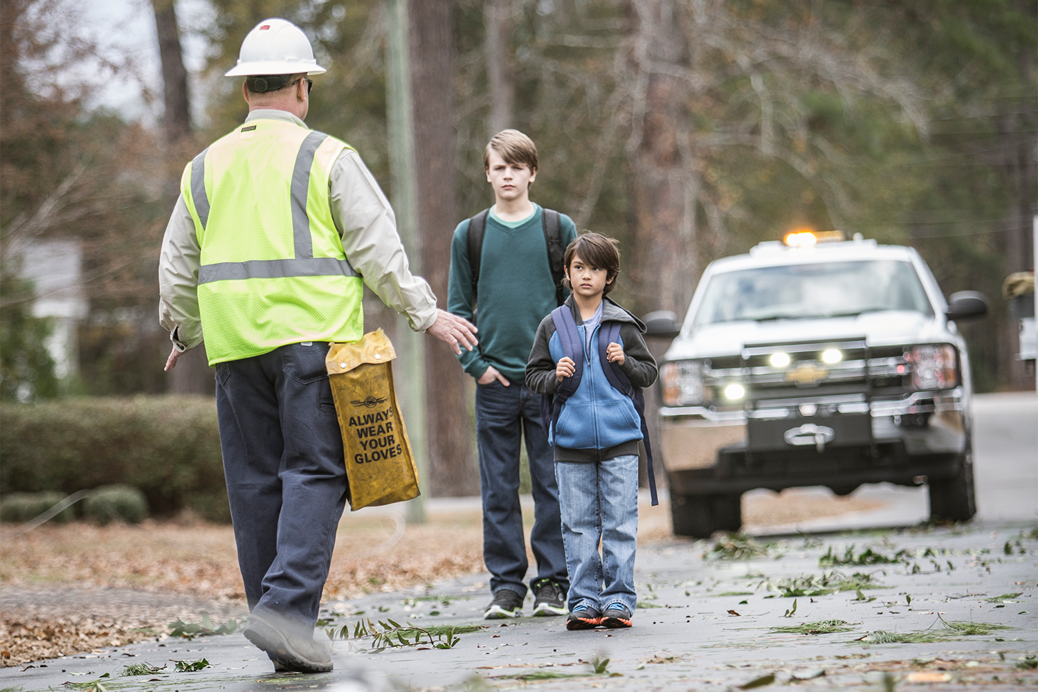 An electric lineman warns children to stay away from downed powerlines
