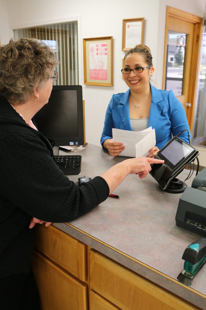 Member Paying Bill at Prosser Office