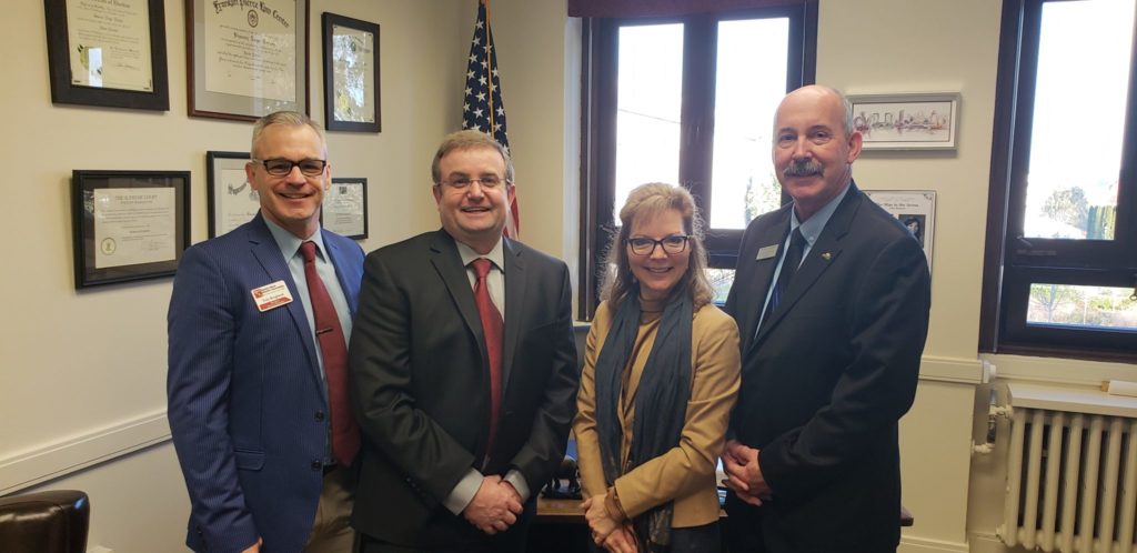 Benton REA’s Troy Berglund, community development and member relations manager, in Olympia with City of West Richland Public Works Director Roscoe Slade, Senator Sharon Brown and West Richland Mayor Brent Gerry