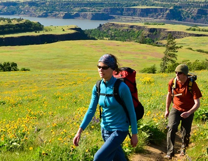 A man and woman hike along the Columbia Gorge in Washington