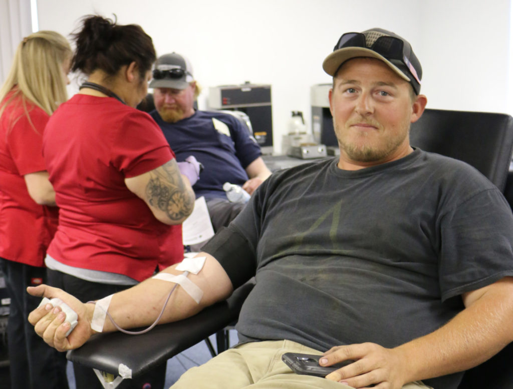 An Apprentice Lineworker donates blood at the Benton REA West Richland Office in 2019
