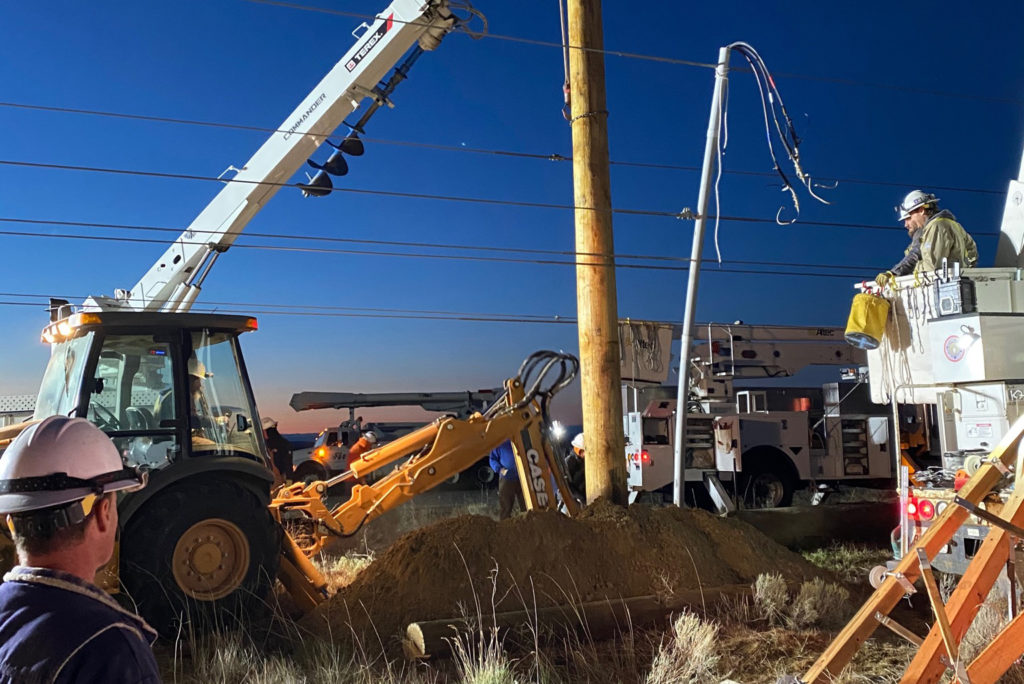 Benton REA and Benton PUD line crews replace a power pole at 5 a.m.