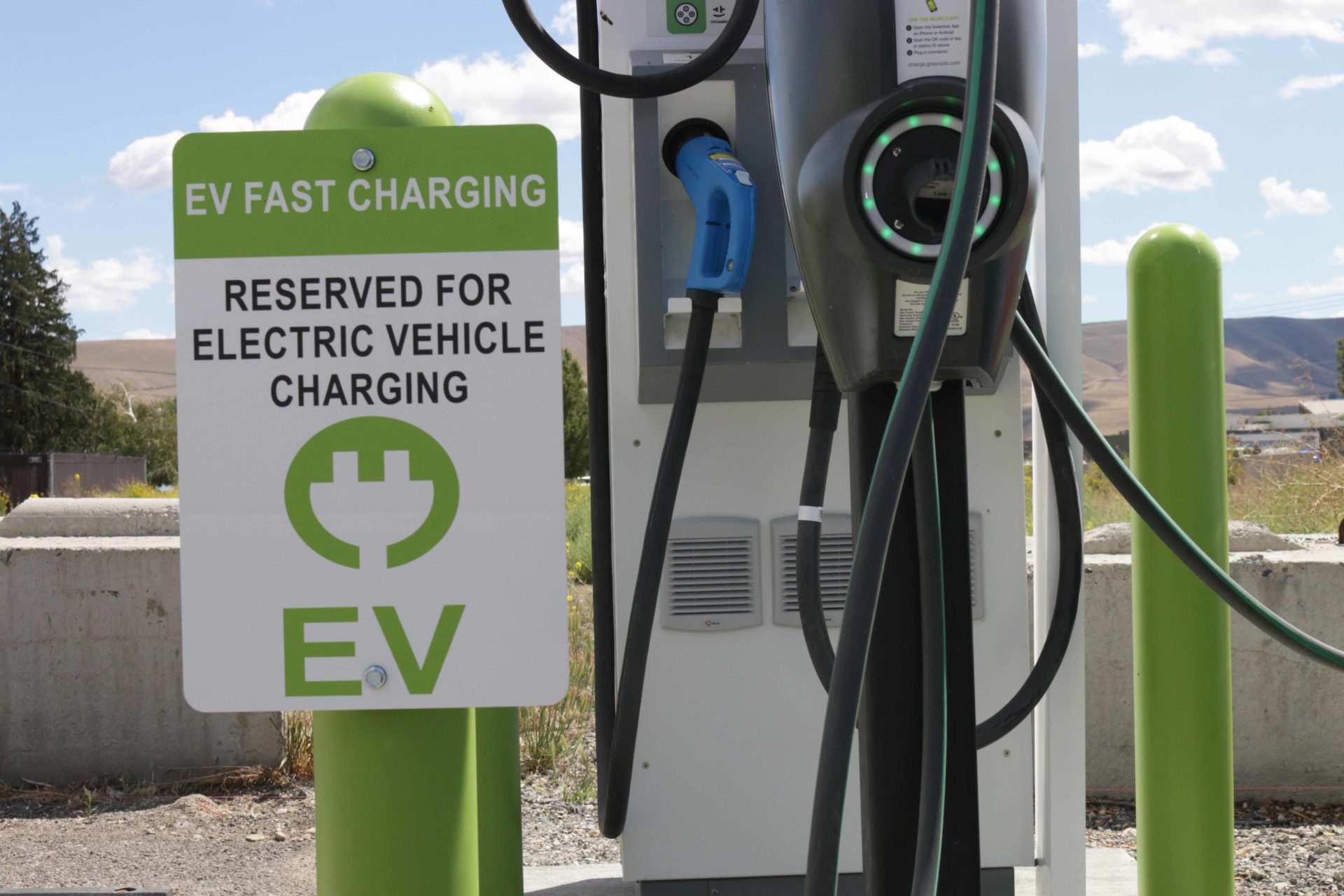 Electric Vehicle Fast Charting station with sign that says "Reserved for Electric Vehicle Charging"