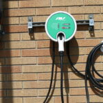 Electric vehicle Level 2 charging stations can be installed inside or outside a home. This one is installed outside. Register your electric vehicle with Benton REA before you install a Level 2 charger and receive $100