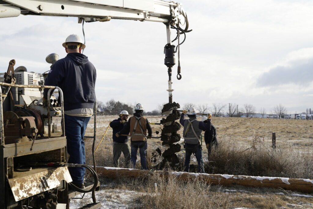 Benton REA Lineworkers dig a hole to set a new power pole. Photo by David Herder.