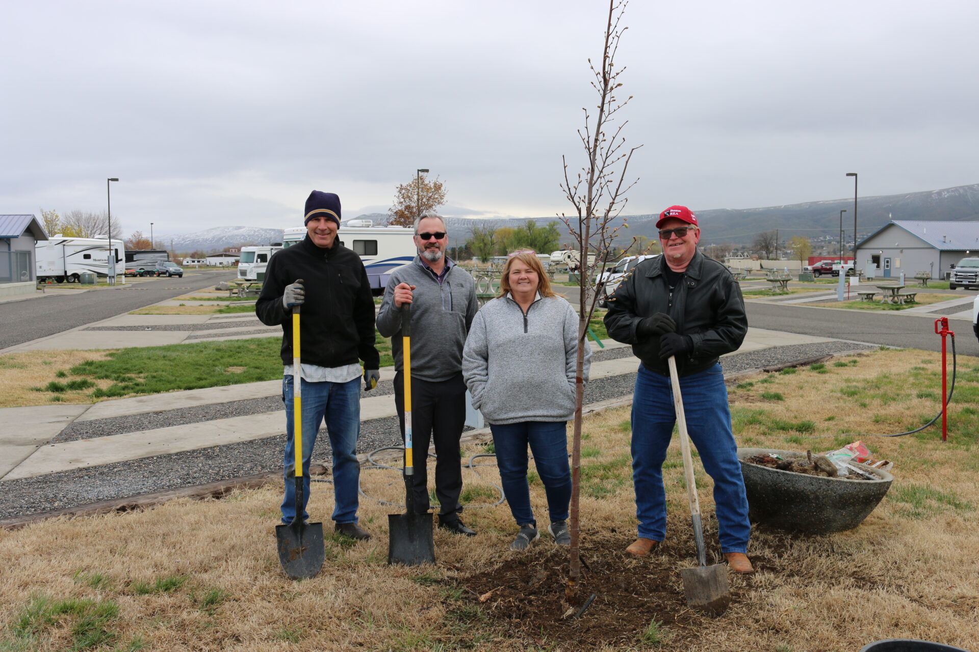Benton REA planted two threes at Wine Country RV Park on April 13 as a part of the Arbor Day Foundation’s Tree Line USA program. Pictured from left: Brian Cramer, area utility tree coordinator; Troy Berglund, Benton REA vice president of member services; Louann Rockney, Wine Country RV Park manager; Mike Freepons, Benton REA trustee.