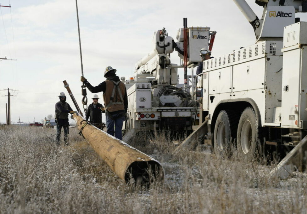 Benton REA Lineworkers prepare to set a new power pole. Photo by David Herder.
